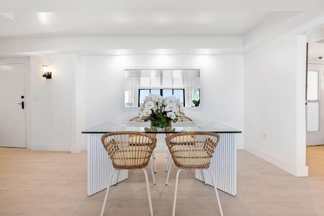 dining space featuring light wood-type flooring