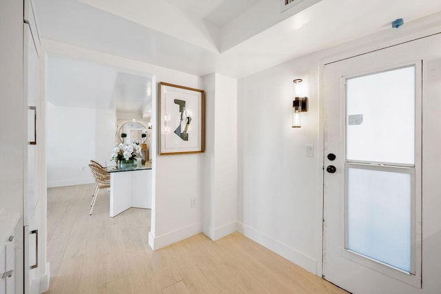 foyer entrance featuring light hardwood / wood-style flooring