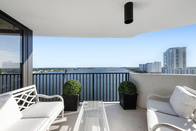 balcony featuring a water view