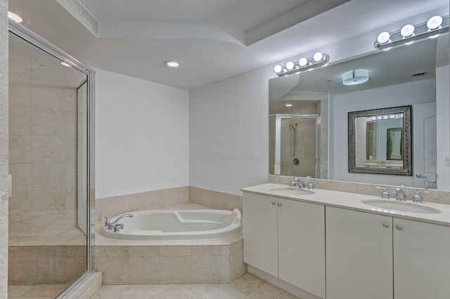 bathroom with vanity, tile patterned floors, and independent shower and bath