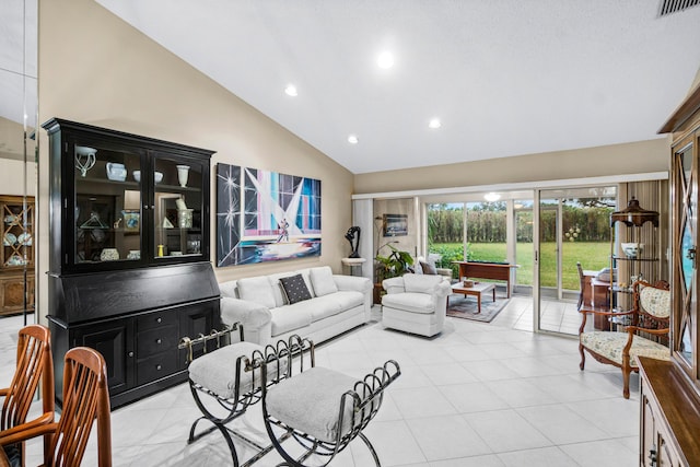 tiled living room featuring high vaulted ceiling