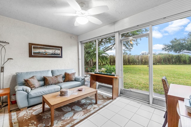 sunroom / solarium featuring ceiling fan