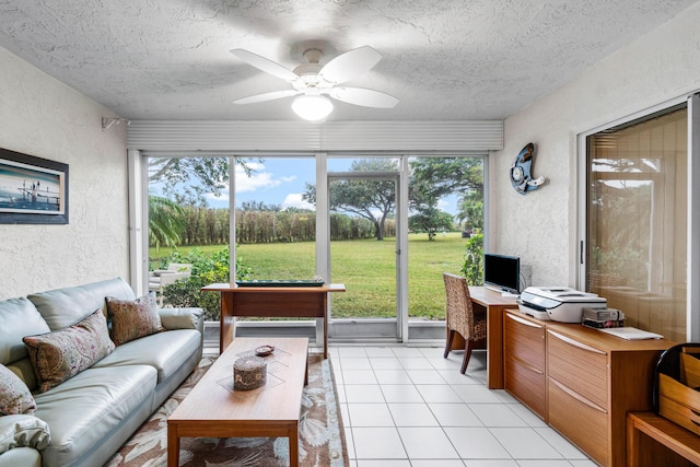 sunroom with a healthy amount of sunlight and ceiling fan