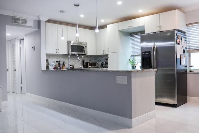 kitchen with crown molding, hanging light fixtures, backsplash, stainless steel appliances, and dark stone counters