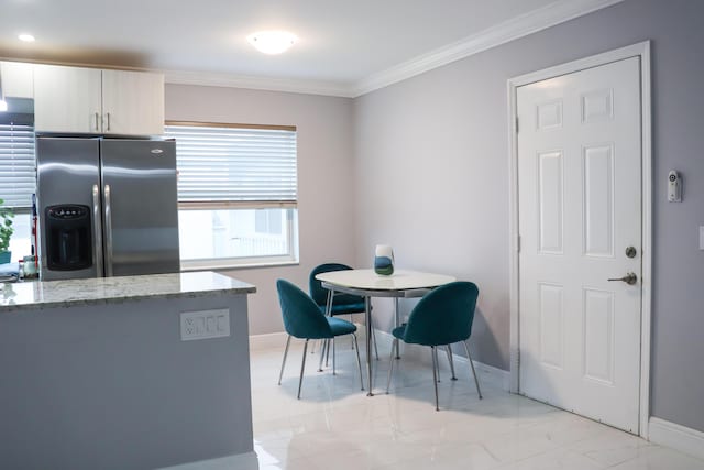 dining area with crown molding