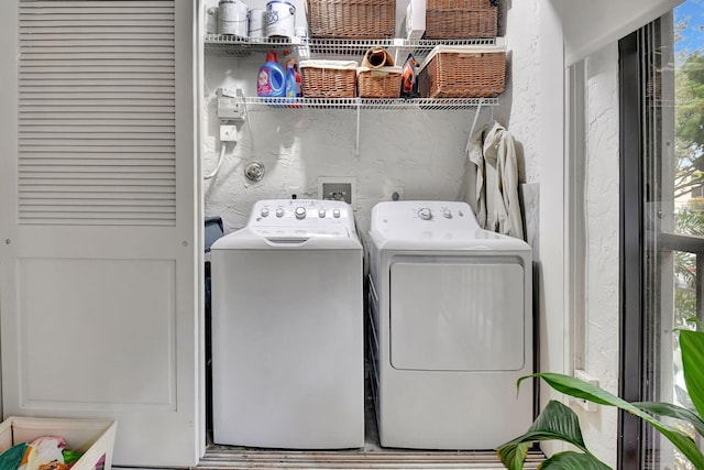 washroom with independent washer and dryer