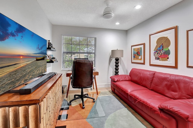 office space with light tile patterned floors, a textured ceiling, and indoor bar