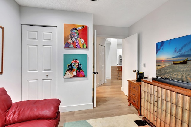 bedroom with a closet and light wood-type flooring