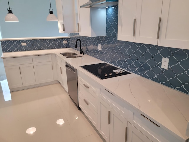 kitchen featuring pendant lighting, stainless steel dishwasher, black electric cooktop, and sink