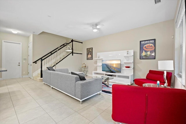 tiled living room featuring ceiling fan