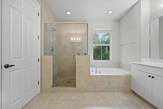 bathroom with separate shower and tub, tile patterned flooring, and vanity