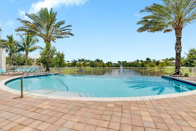 view of swimming pool with a patio