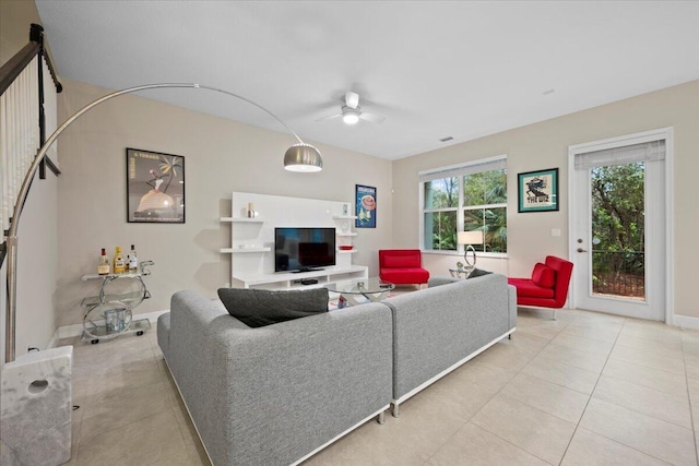 tiled living room featuring ceiling fan