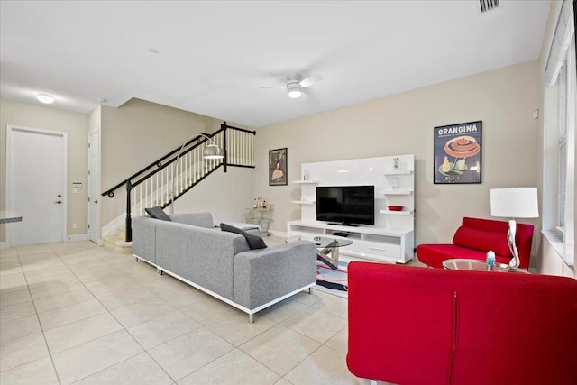 tiled living room featuring ceiling fan