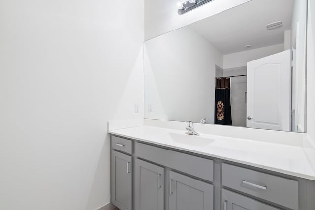 bathroom featuring vanity and walk in shower