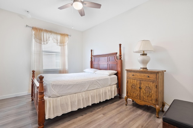 bedroom featuring hardwood / wood-style floors and ceiling fan