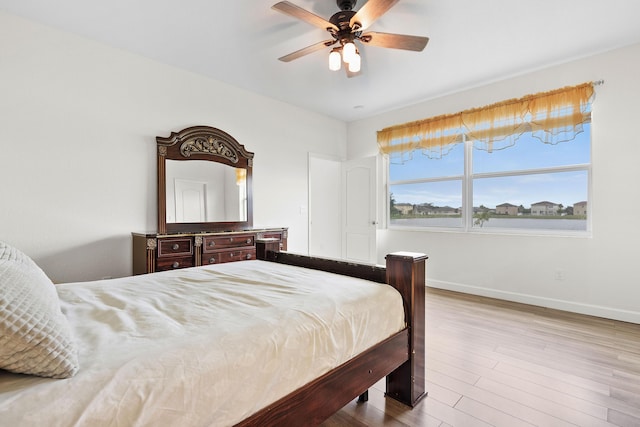 bedroom featuring ceiling fan and light hardwood / wood-style floors