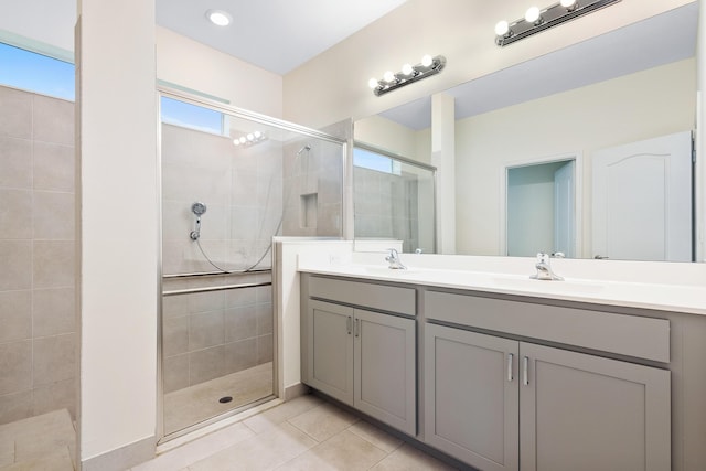 bathroom with vanity, tile patterned flooring, and a shower with door