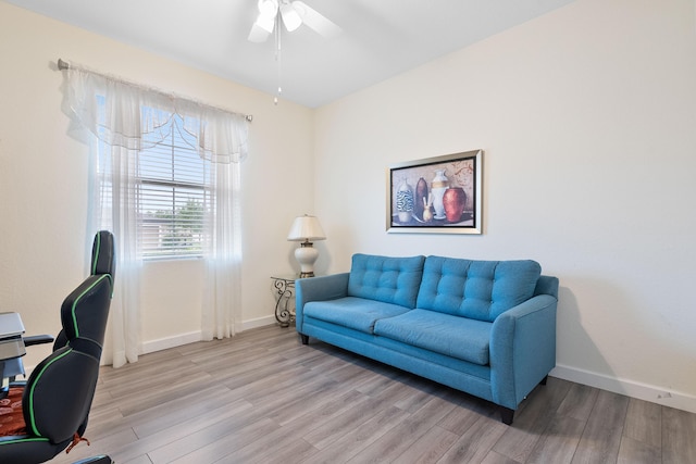 home office with ceiling fan and light wood-type flooring