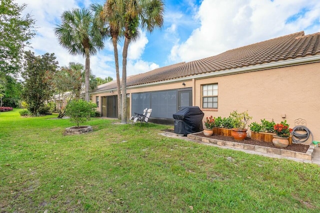 view of yard with a fire pit