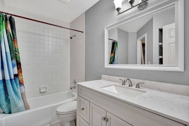 full bathroom with vanity, shower / bath combination with curtain, tile patterned floors, and toilet