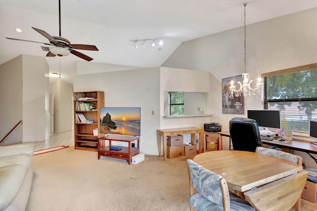 carpeted office space with ceiling fan with notable chandelier and high vaulted ceiling