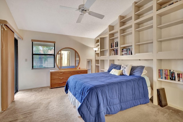 bedroom with vaulted ceiling, ceiling fan, light carpet, and a textured ceiling