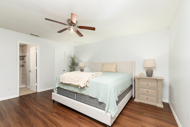 bedroom featuring ensuite bathroom, dark wood-type flooring, and ceiling fan