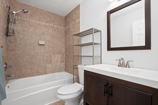 full bathroom with vanity, toilet, and tiled shower / bath