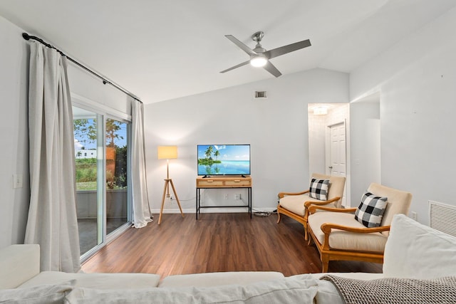 living room with dark wood-type flooring, vaulted ceiling, and ceiling fan