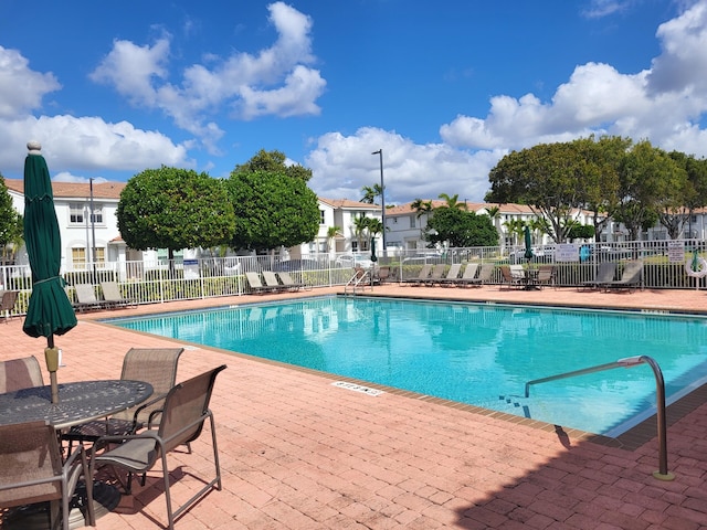 view of swimming pool featuring a patio area