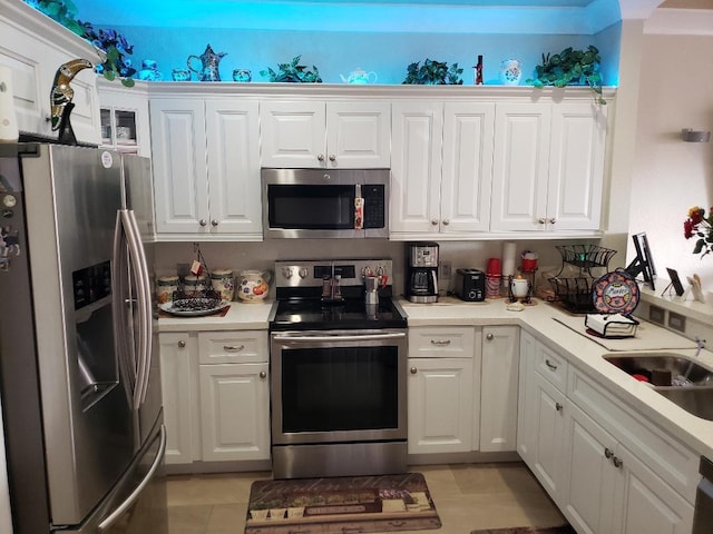 kitchen featuring white cabinetry, stainless steel appliances, and sink