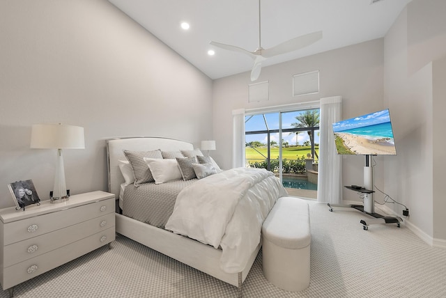 bedroom with access to outside, light colored carpet, and ceiling fan