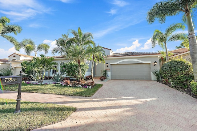 mediterranean / spanish-style home featuring a garage