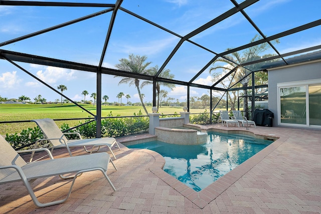 view of swimming pool with a grill, a yard, a patio area, and glass enclosure