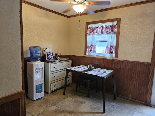 office with wooden walls, wainscoting, and crown molding