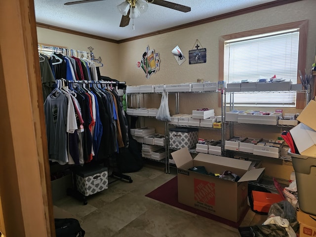 walk in closet featuring a ceiling fan