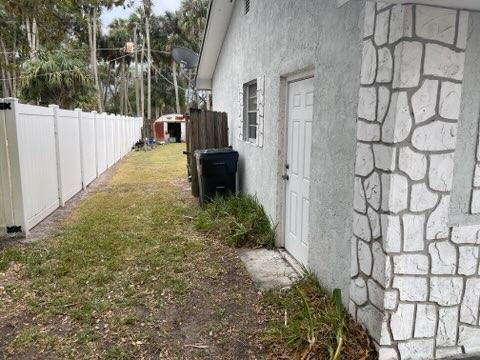 view of property exterior featuring a lawn