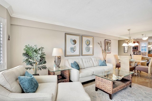 living room featuring a chandelier and ornamental molding