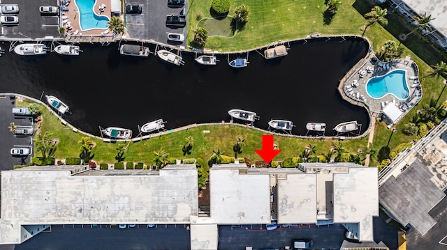 birds eye view of property with a water view