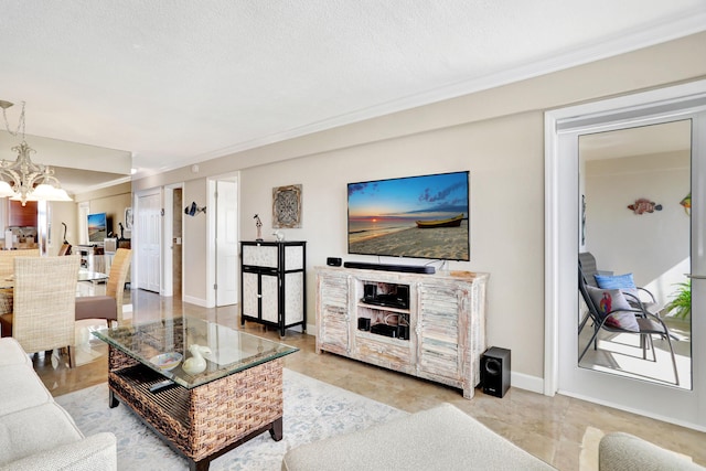 living room with a textured ceiling, crown molding, and an inviting chandelier