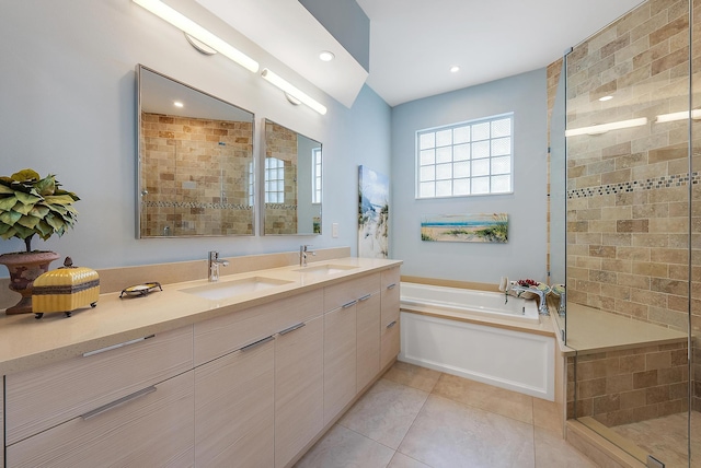 bathroom with tile patterned flooring, vanity, and independent shower and bath