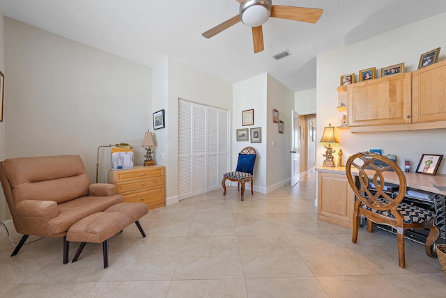 sitting room featuring light tile patterned floors and ceiling fan