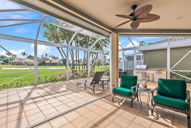 unfurnished sunroom with ceiling fan