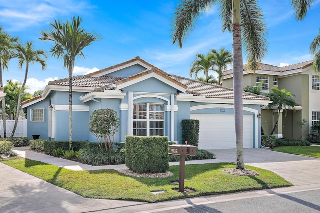 mediterranean / spanish-style home featuring a garage