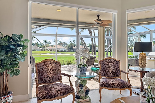 sunroom / solarium with ceiling fan