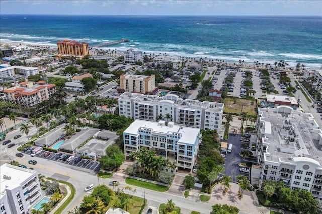 bird's eye view featuring a view of the beach and a water view