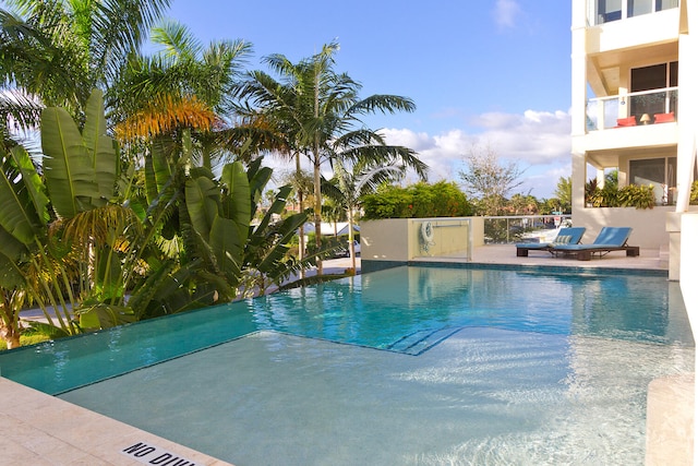 view of pool featuring a patio area