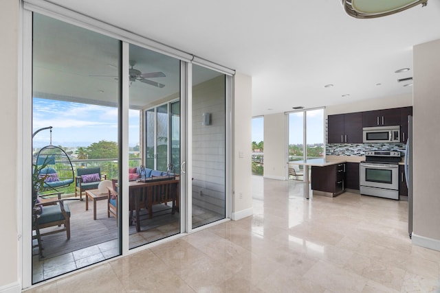 interior space with plenty of natural light, stainless steel appliances, dark brown cabinets, and backsplash