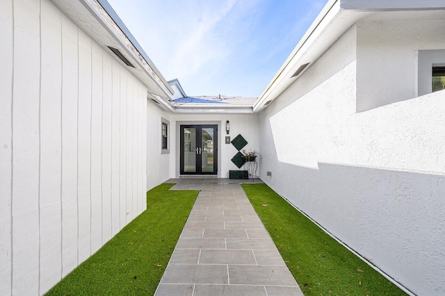 51 Woods Ln, Boynton Beach, FL 33436 - property entrance featuring french doors and stucco siding